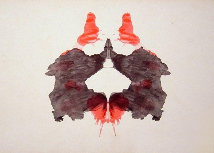 Rorschach card II, a black inkblot with red areas